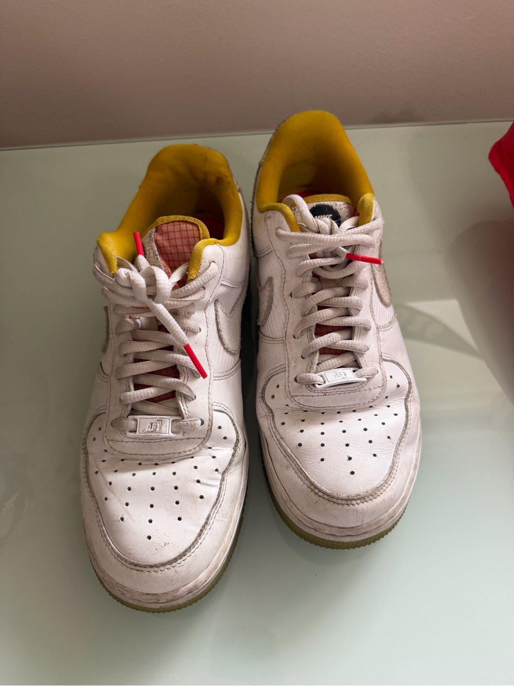 White Athletic Sneakers with Yellow Lining and Red Lace Tips